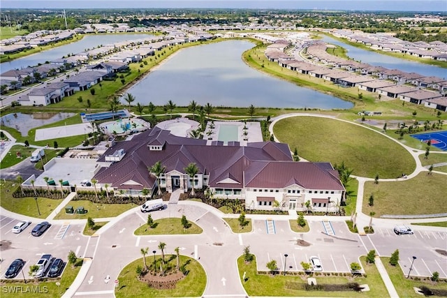 birds eye view of property featuring a water view