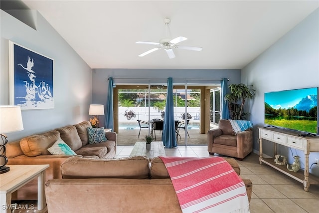 tiled living room featuring ceiling fan and lofted ceiling