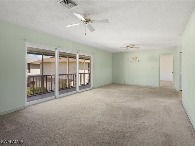 spare room with carpet flooring, a textured ceiling, and ceiling fan