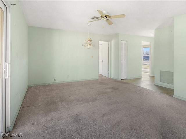 unfurnished room with ceiling fan and light colored carpet