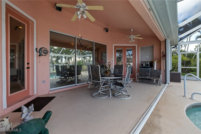 view of patio with french doors and ceiling fan