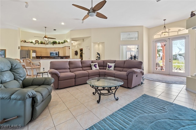 living room with light tile patterned floors, french doors, and ceiling fan