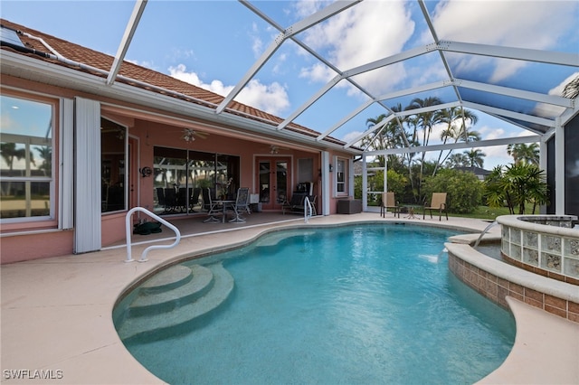 view of pool featuring a lanai, ceiling fan, french doors, and a patio