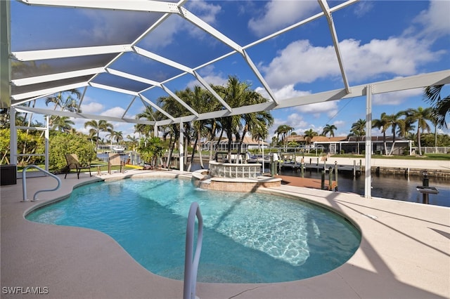 view of swimming pool featuring glass enclosure, a water view, and a patio