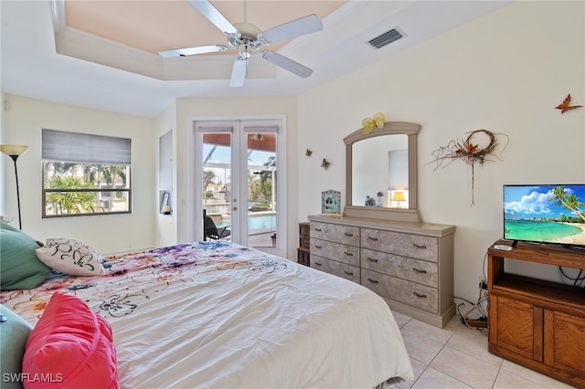 bedroom with ceiling fan, french doors, a raised ceiling, access to outside, and light tile patterned flooring