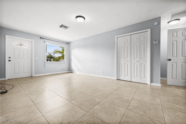 entrance foyer with light tile patterned flooring