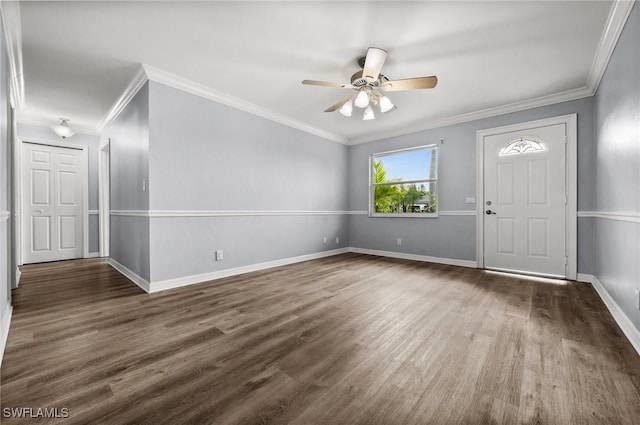 entryway with ceiling fan, crown molding, and dark wood-type flooring