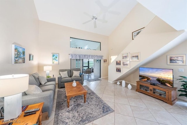 living room with ceiling fan, light tile patterned floors, and high vaulted ceiling