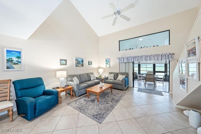 tiled living room featuring ceiling fan and high vaulted ceiling