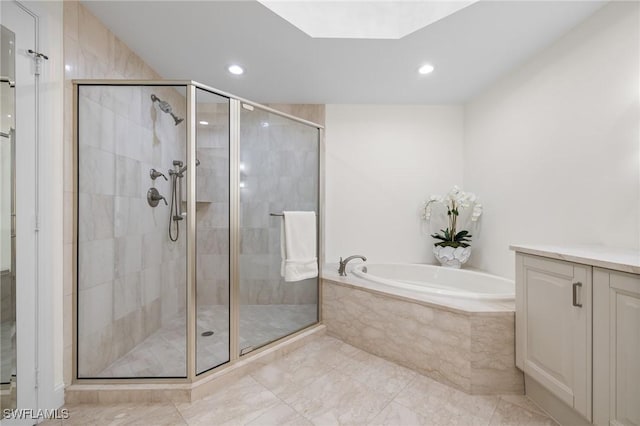 bathroom with shower with separate bathtub