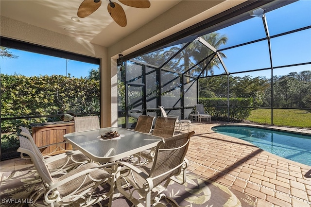 exterior space featuring a lanai and ceiling fan