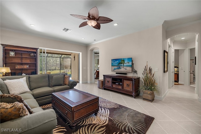 tiled living room with ceiling fan and ornamental molding