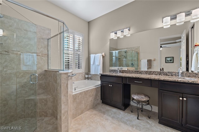 bathroom with tile patterned floors, vanity, separate shower and tub, and ceiling fan