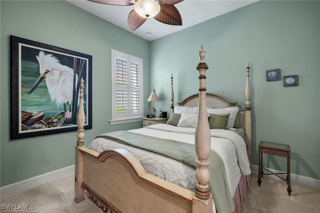 bedroom with ceiling fan and light carpet