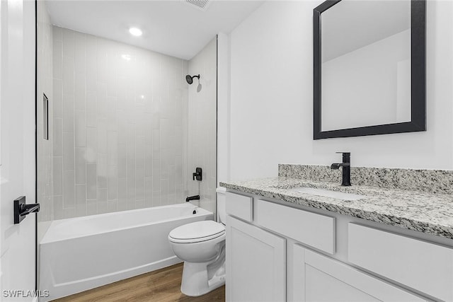 3226 NW 3rd Pl, Cape Coral, FL 33993 - full bathroom featuring wood finished floors, toilet, vanity, tub / shower combination, and recessed lighting