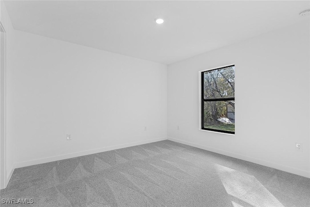 3226 NW 3rd Pl, Cape Coral, FL 33993 - empty room with carpet floors, baseboards, and recessed lighting