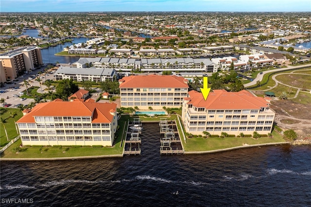 birds eye view of property featuring a water view