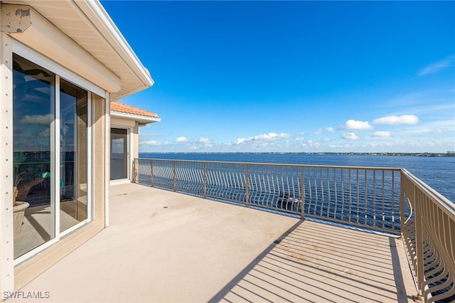 balcony featuring a water view