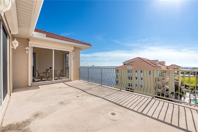 view of patio featuring a balcony