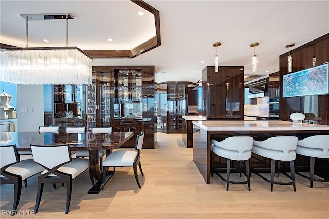 dining area with light hardwood / wood-style floors