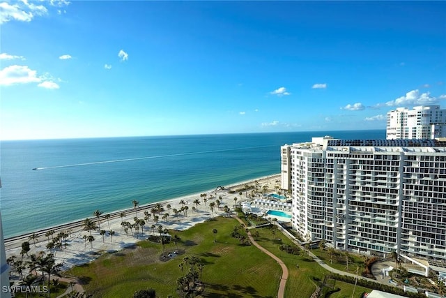 aerial view with a water view and a beach view