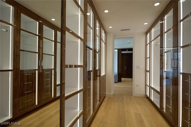 hallway with french doors and light wood-type flooring