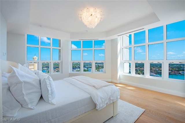 bedroom with hardwood / wood-style floors