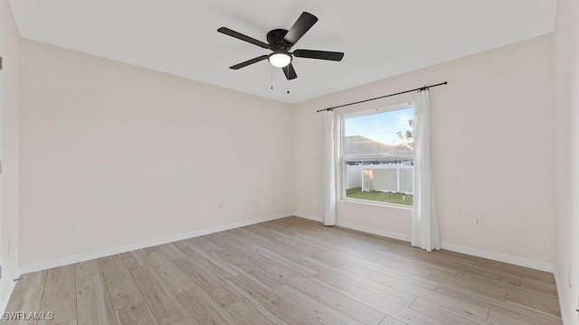 unfurnished room with ceiling fan and light hardwood / wood-style flooring