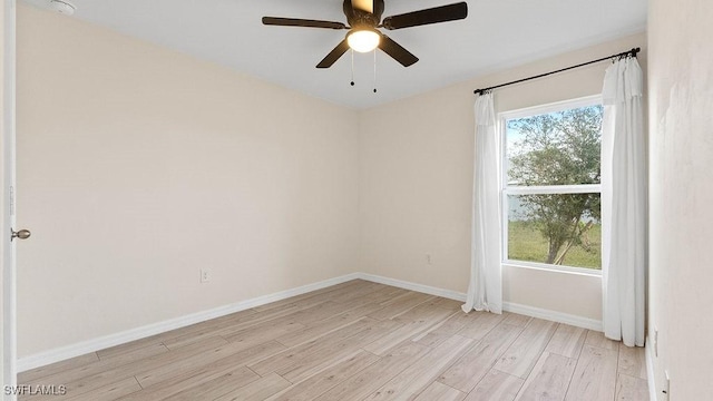 empty room with ceiling fan and light wood-type flooring