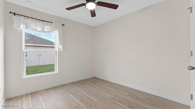 empty room featuring light wood-type flooring, plenty of natural light, and ceiling fan