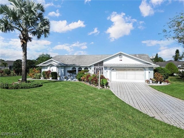 single story home featuring a front lawn and a garage