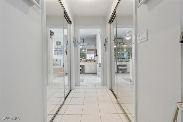 corridor with light tile patterned floors