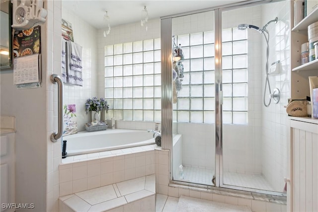 bathroom featuring tile patterned floors and plus walk in shower