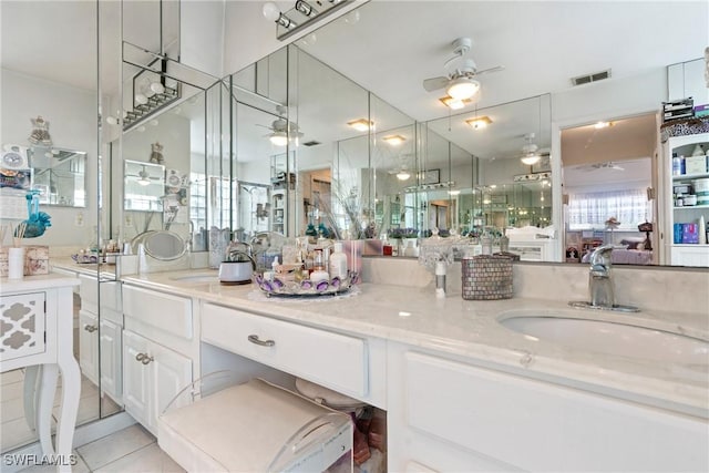 bathroom with tile patterned flooring and vanity