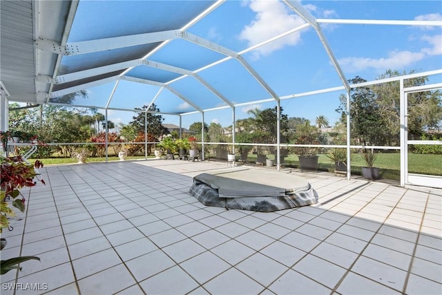 view of patio / terrace featuring glass enclosure