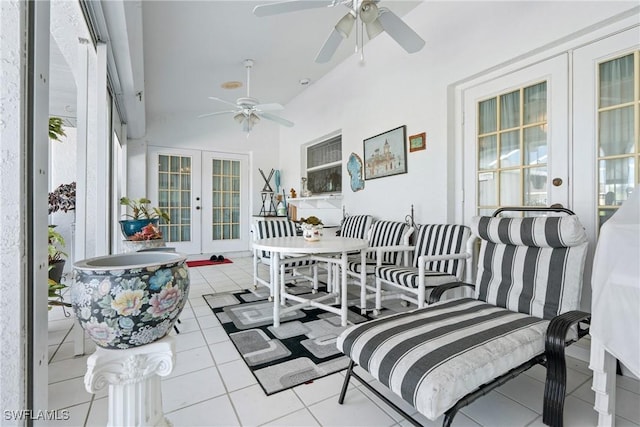 sunroom featuring ceiling fan, lofted ceiling, and french doors