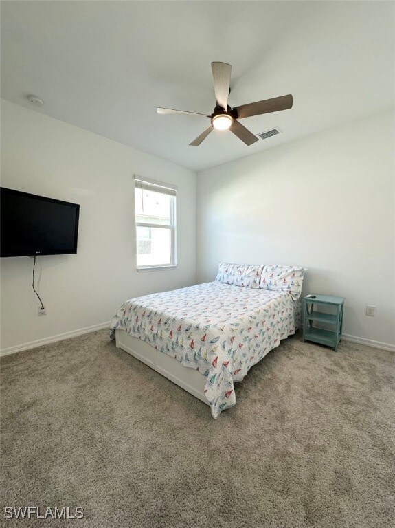 bedroom featuring carpet flooring and ceiling fan