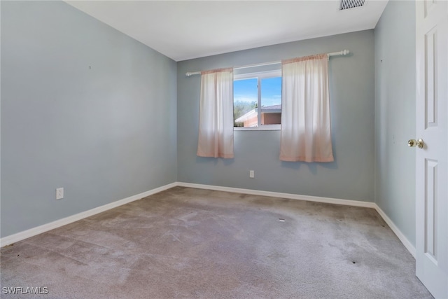 empty room featuring light carpet