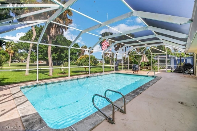 view of swimming pool featuring a patio and a lanai