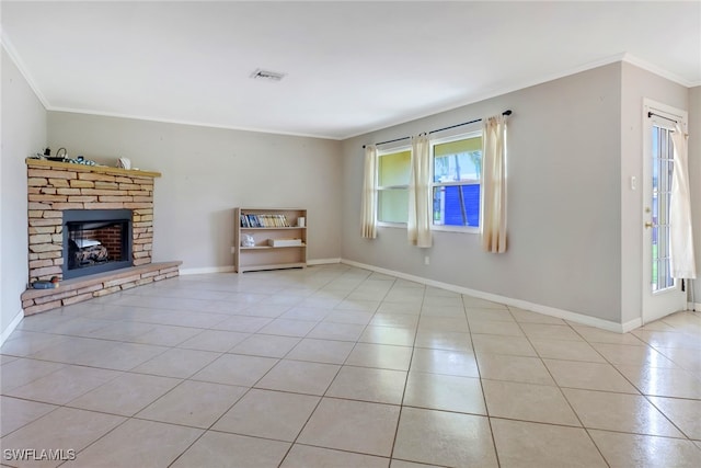 unfurnished living room featuring a fireplace, light tile patterned floors, and ornamental molding