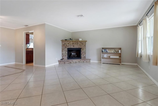 unfurnished living room with crown molding, light tile patterned floors, and a fireplace