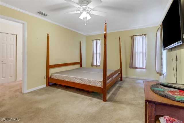 bedroom featuring light carpet, ceiling fan, and crown molding