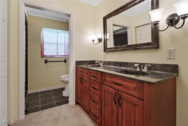 bathroom featuring tile patterned flooring, vanity, toilet, and ornamental molding