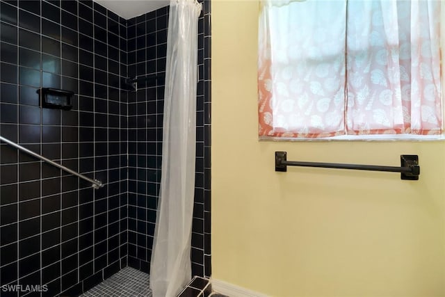 bathroom with a shower with shower curtain