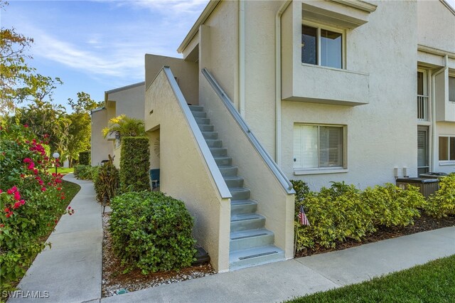 view of side of property with central AC