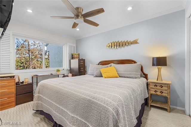 carpeted bedroom with ceiling fan and ornamental molding