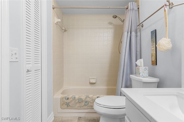 full bathroom with vanity, shower / bath combination with curtain, and toilet