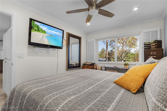 bedroom with ceiling fan and ornamental molding