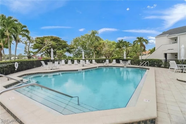 view of swimming pool with a patio area