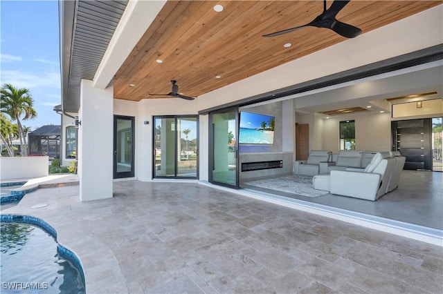 view of patio featuring ceiling fan